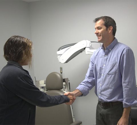 Ent doctor shaking hands with patient.